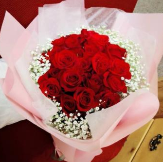 Wrapped red roses