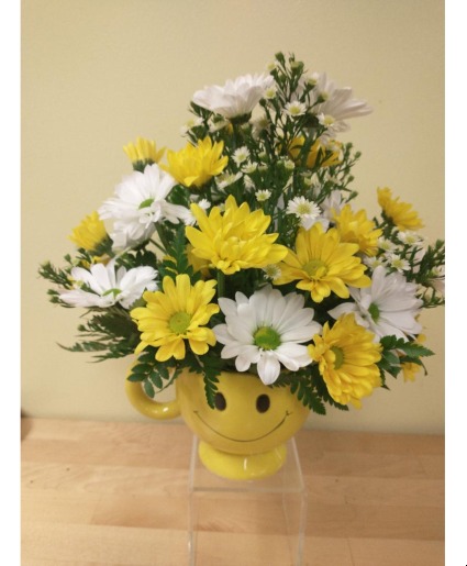 yellow and white daisies in smile mug