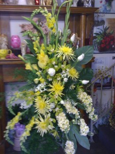 Yellow  and Wht  Standing Spray Arrangement on standing easel
