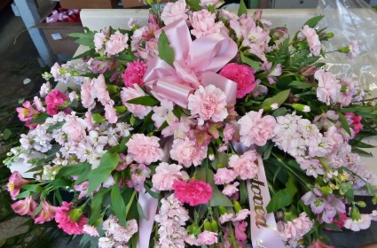 you are in our prayers pretty pink casket spray  sympathy 